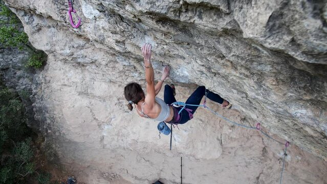  Strong female climber climbing in Calders, Catalonia, Spain. High quality 4k footage.