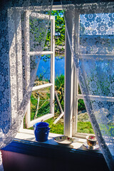 Open window in a cottage with a lake view - obrazy, fototapety, plakaty
