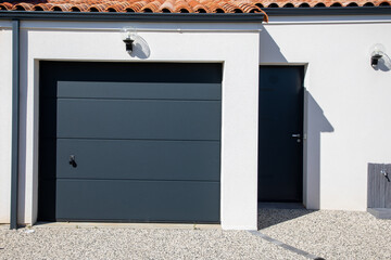door gray modern on facade white closed new garage home gate at entrance of private house