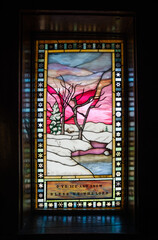 Stain Glass Window at the rustic log Chapel of the Transfiguration at the Grand Teton National Park in Northwestern Wyoming