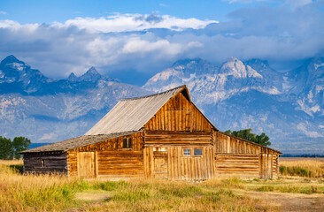 Fototapeta na wymiar The John Moulton Barn and the Teton Range at Grand Teton National Park in Northwestern Wyoming