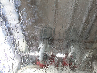 Car glass at a car wash In drops of water. Background