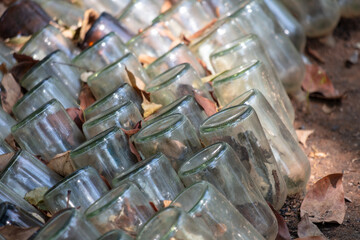 Glass bottles lie on the ground. Background