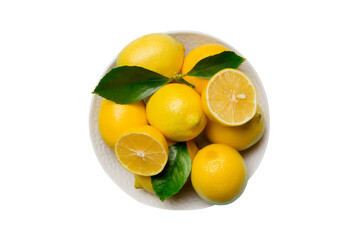 Fresh cutted lemon and whole lemons over round plate isolated on white background. Food and drink...