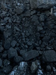 A pile of black coal in the barn