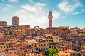 Siena, medieval town in Tuscany, with view of the Dome & Bell Tower of Siena Cathedral,  Mangia Tower and Basilica of San Domenico, Italy