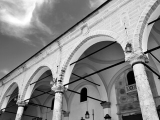 In front of the historical mosque in İzmir Kemeraltı Bazaar.The columns are striking and have...