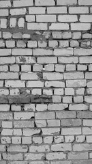 Gray Texture of a White Brick Wall. Large gaps between the bricks. The curve of the brickwork. Aged...