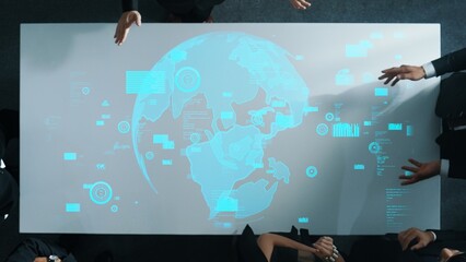 Top down aerial of business team brainstorm idea about digital communication or global network connection. Group of diverse business people discuss about data processing at meeting room. Directorate.