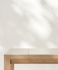 Minimal wooden counter table in dappled sunlight, leaf shadow on beige cream wall for modern,...