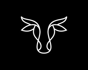Cow head in line art vector logo