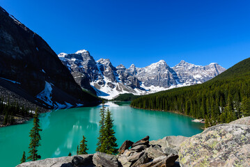Beautiful mountain view with a blue sky, road trip iBeautiful turquoise waters of the Moraine lake...