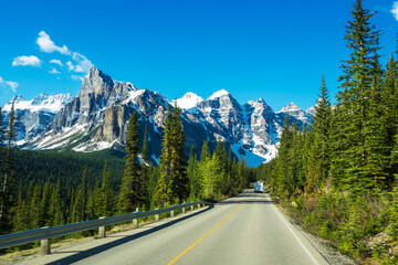 Driving  to Moraine Lake with the view of ten peaks against the blue sky, Banff National Park,...