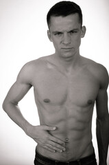 Fototapeta premium Young attractive man posing in the studio.