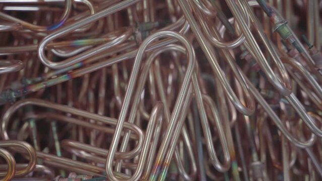Stacked steel tubes of the heat exchanger. Mass factory production. Heating element.