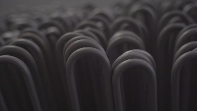 Stacked steel tubes of the heat exchanger. Mass factory production. Heating element.