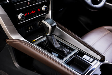 automatic transmission shift selector in the car interior. Closeup a manual shift of modern car gear shifter. 4x4 gear shift	