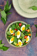 Green salad with nettles and egg.