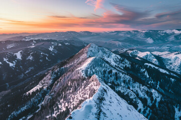 Aerial view of mountain ridge, winter during sunset 