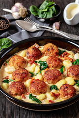tuscan chicken meatballs with gnocchi in a dish
