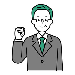 ガッツポーズをする年配のスーツの男性