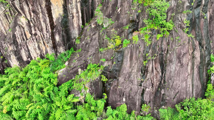 With a drone's-eye view, we navigate over rocky precipices, bordered by a thriving rainforest, immersing ourselves in the unspoiled wonder of the great outdoors. Thailand.

