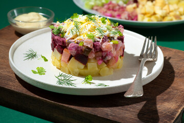 Rosolje -  Estonian beet and herring salad or Rosoli Finland salad with boiled beets, potatoes,...
