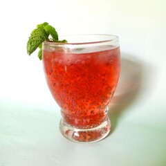 Energy drinks with mint leaves and black seeds. Red drinks refresh you in summer. Red drinks in glass. 