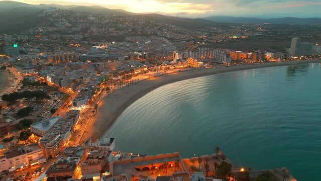 Aerial view of Peniscola beach and castle at twilight on Costa del Azahar, Spain