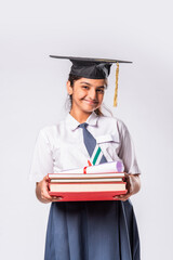 Indian asian cute little school girl wesra graduation white against white background