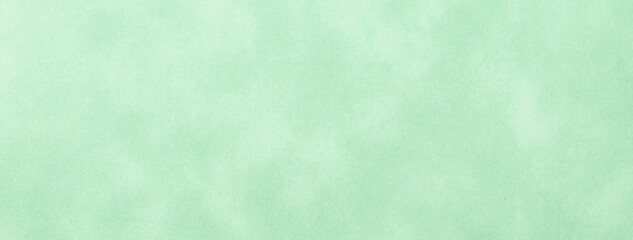 Texture of light green old paper, crumpled background. Vintage olive grunge surface backdrop.