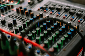A mixer, an audio equipment for sound systems, displayed at a venue hosting an event, showcasing...