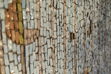Small tiles. Mosaic on wall. Picture of shards.