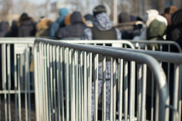 Steel Fence At Concert. Fences from the crowd. Mass gathering of people in children's rooms.
