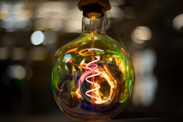 Colored lamp. Beautiful glass. Incandescent lamp made of bright glass.