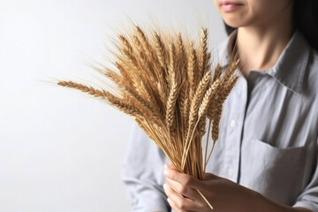 generated Illustration of Farmer holding a bunch of ripe cultivated wheat ears in hands.