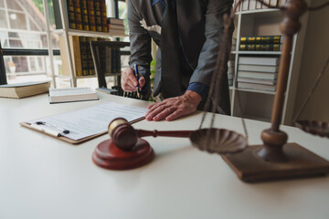 A lawyer or legal advisor is reading business evidence. Legal matters and carefully check the...