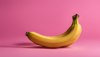 Three yellow bananas on a pink background