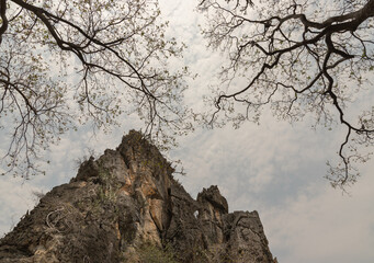 Beautiful scenery view of Mountain rock cliff and Tree Branches against sky background at Khao Nang...