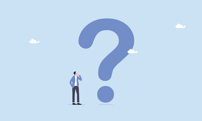 Big question mark or big problem to solve or finding solution, businessman thinking while looking at big question mark, oubt or uncertainty, thinking to make decision.