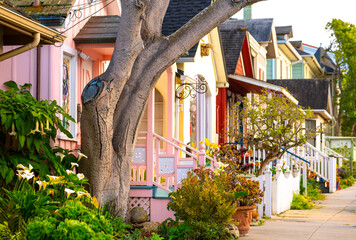 Colorful historic houses Pacific Grove, a picturesque village near Monterey, California). Charming wooden facades and well kept gardens in stylish vintage neighbourhood. Popular tourist destination