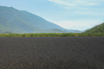 Empty asphalt road in mountains. Picturesque landscape