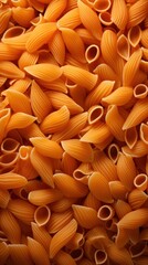 Close-up of dry penne pasta filling the frame, showcasing the texture and shape of this classic Italian pasta type.