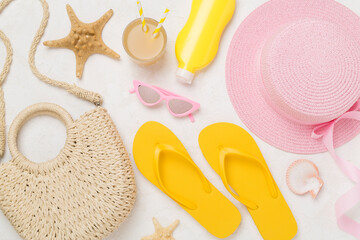 Flat lay with colorful beach accessories on concrete background. Vacation concept