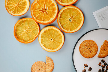 Layers of sun-dried orange slices arranged to highlight their translucency and rich textures,...