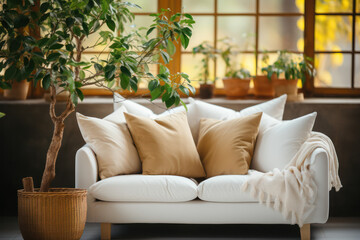 Cozy Living Room with Indoor Greenery.Elegant white sofa adorned with gold and white pillows, complemented by indoor plants, creating a cozy and inviting living space.