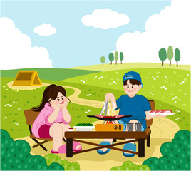 A man and a woman enjoying a barbecue in a green lawn campsite. There are stoves, tables, cups, and vegetables on the table.