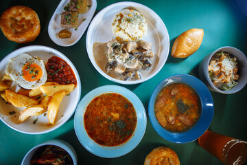 Table full of delicious traditional russian food with beer and bread