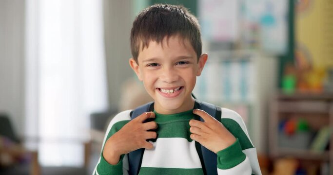 Child, face and laughing in school classroom or education with backpack for kindergarten, learning or joke. Boy, kid and portrait for study development on academy campus or student, humor or funny
