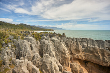 Rock crag formations along New Zealand coastline